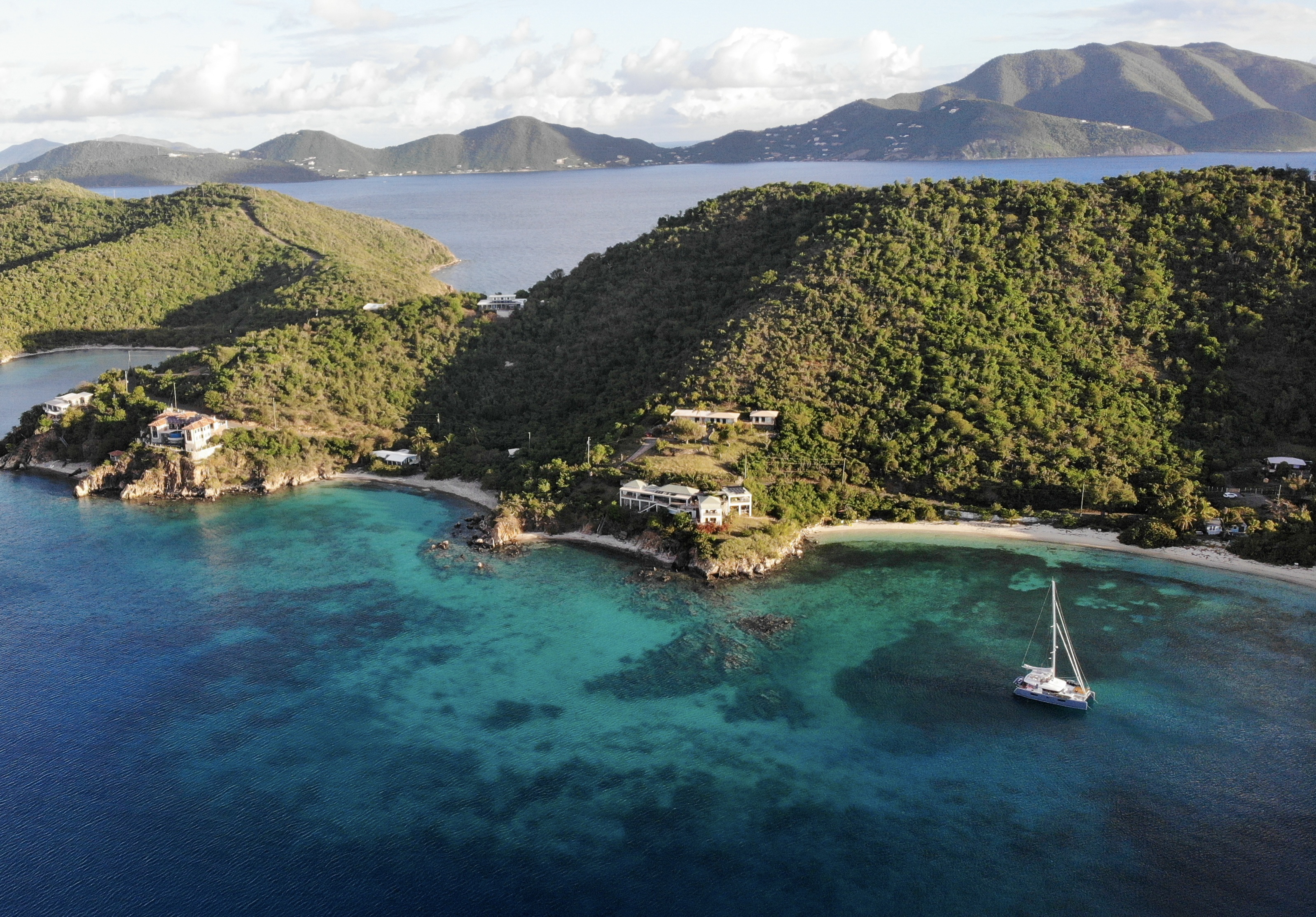 Aerial view of Hansen Bay, St. John with turquoise water and sailboat